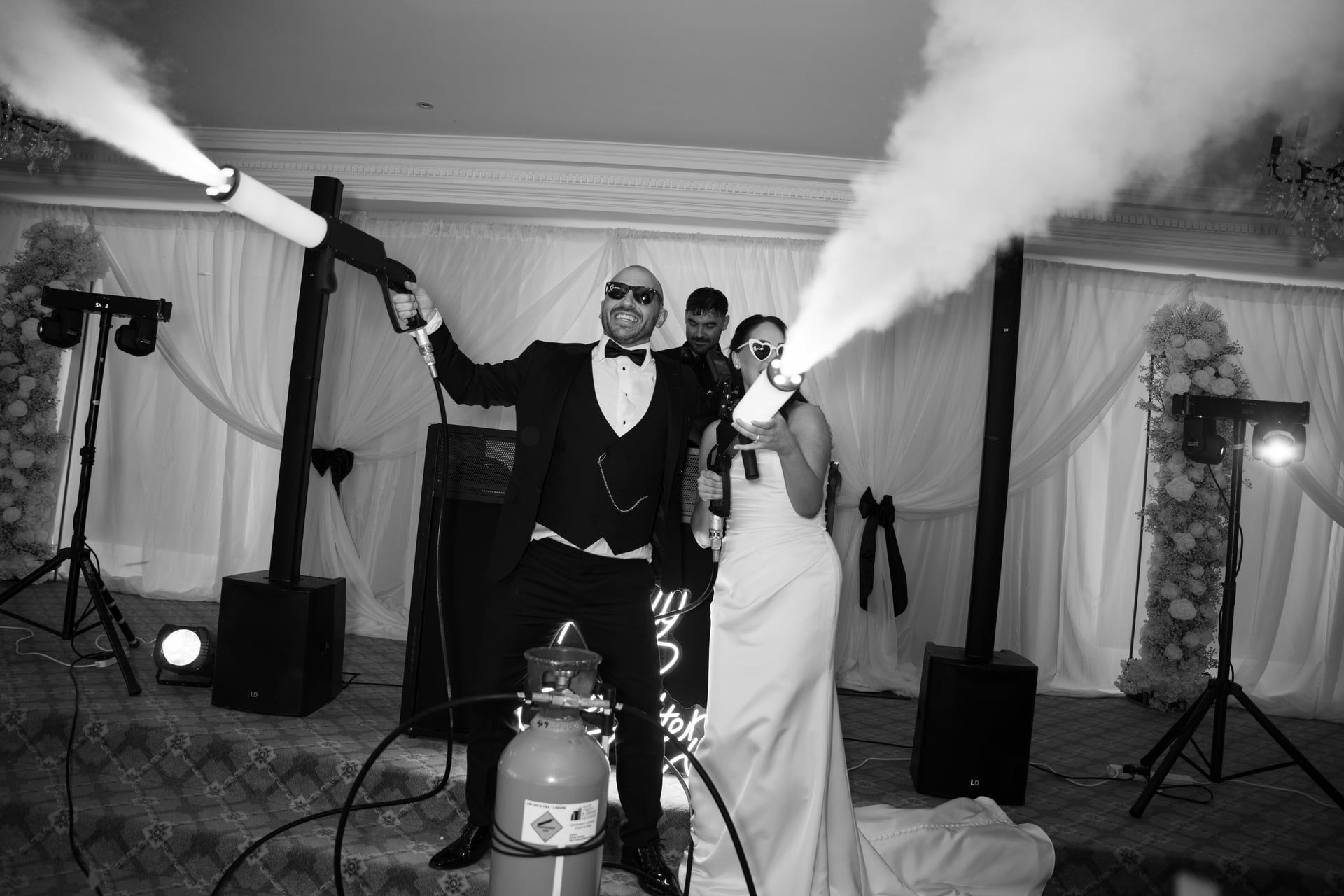 A newly married couple firing CO₂ party guns on the dance floor