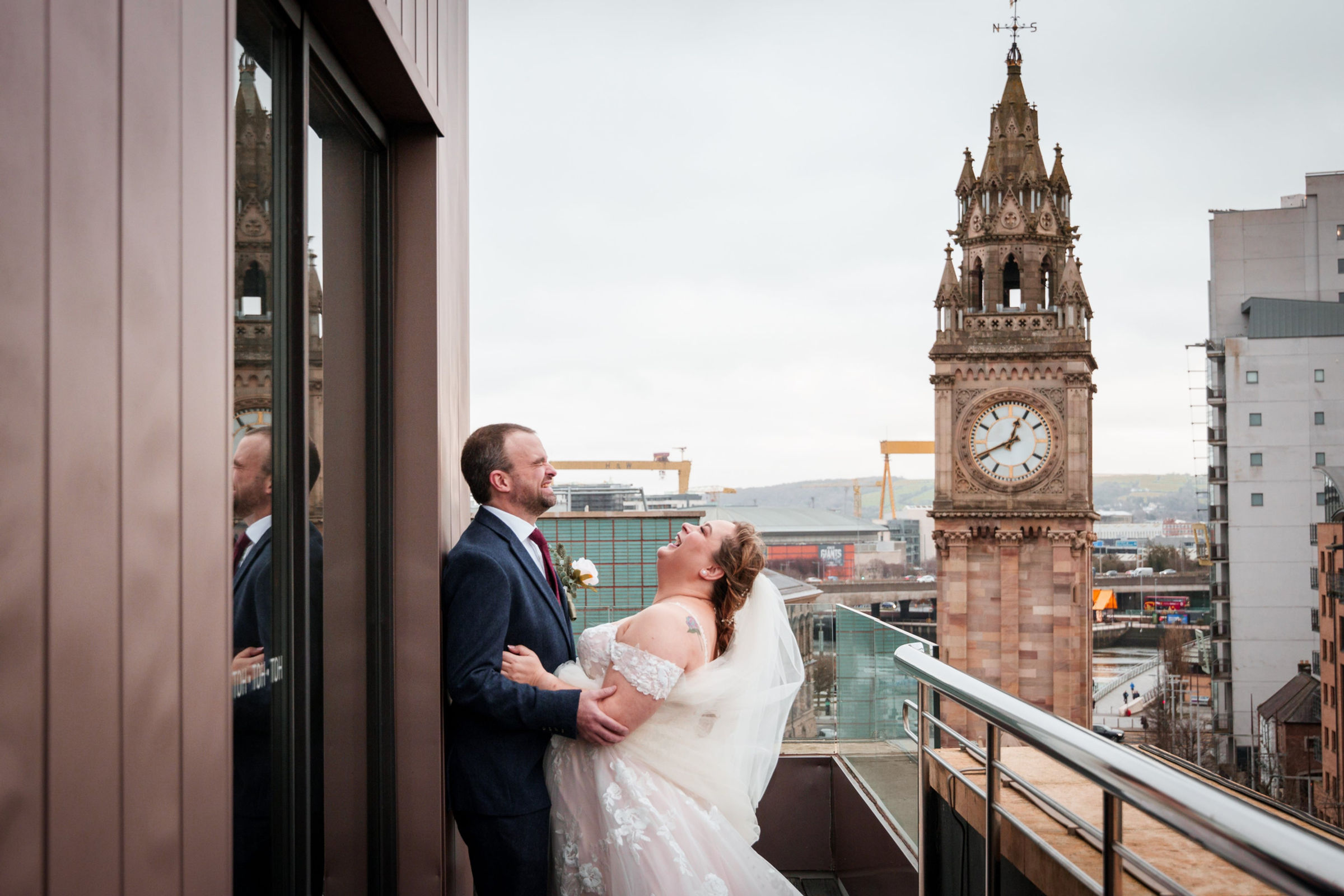 Natasha and Robin laughing together on The Merchant roof terrace